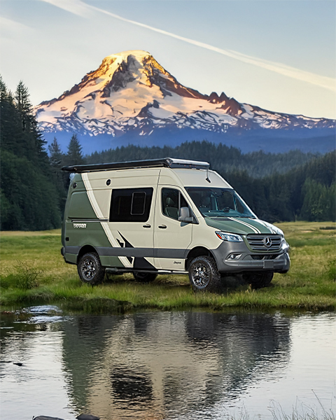 Class B campervan at Mount Rainier reflecting in alpine lake
